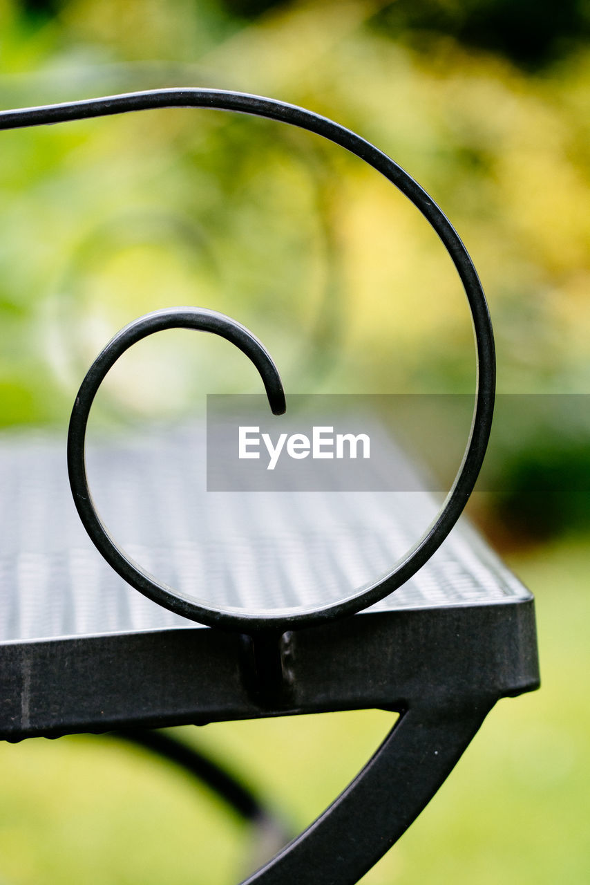 Close-up of bench at park