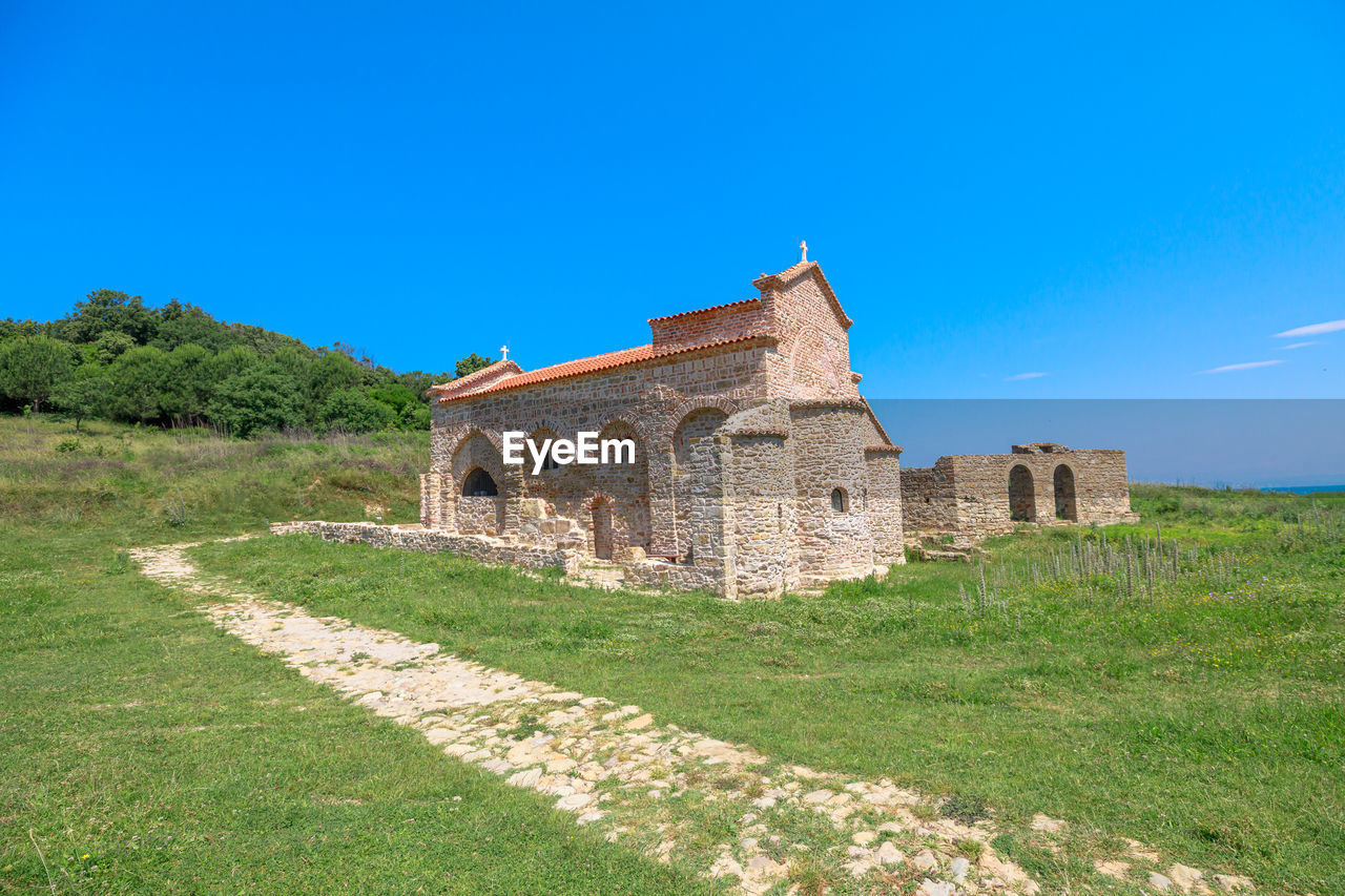 view of old ruins against clear blue sky