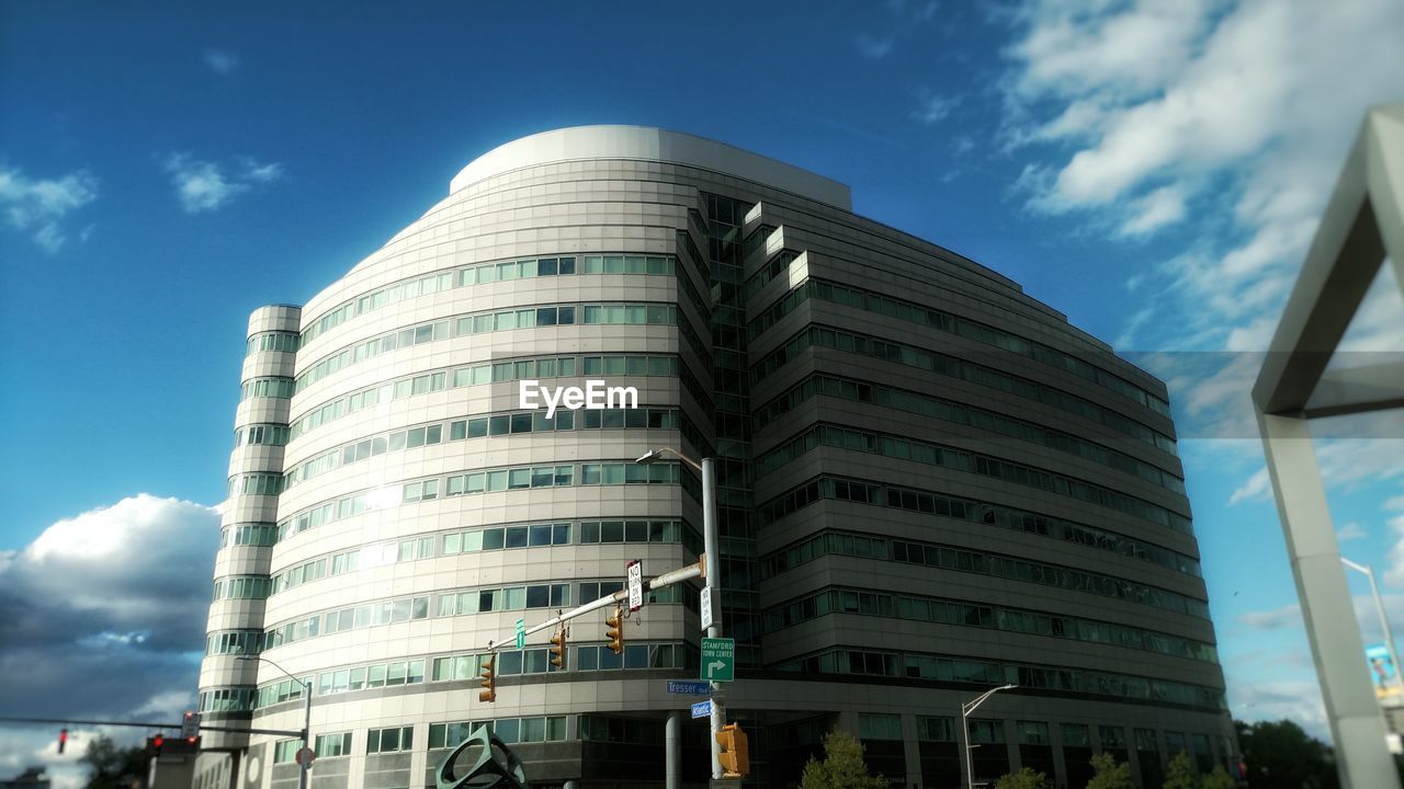 LOW ANGLE VIEW OF MODERN BUILDINGS AGAINST SKY