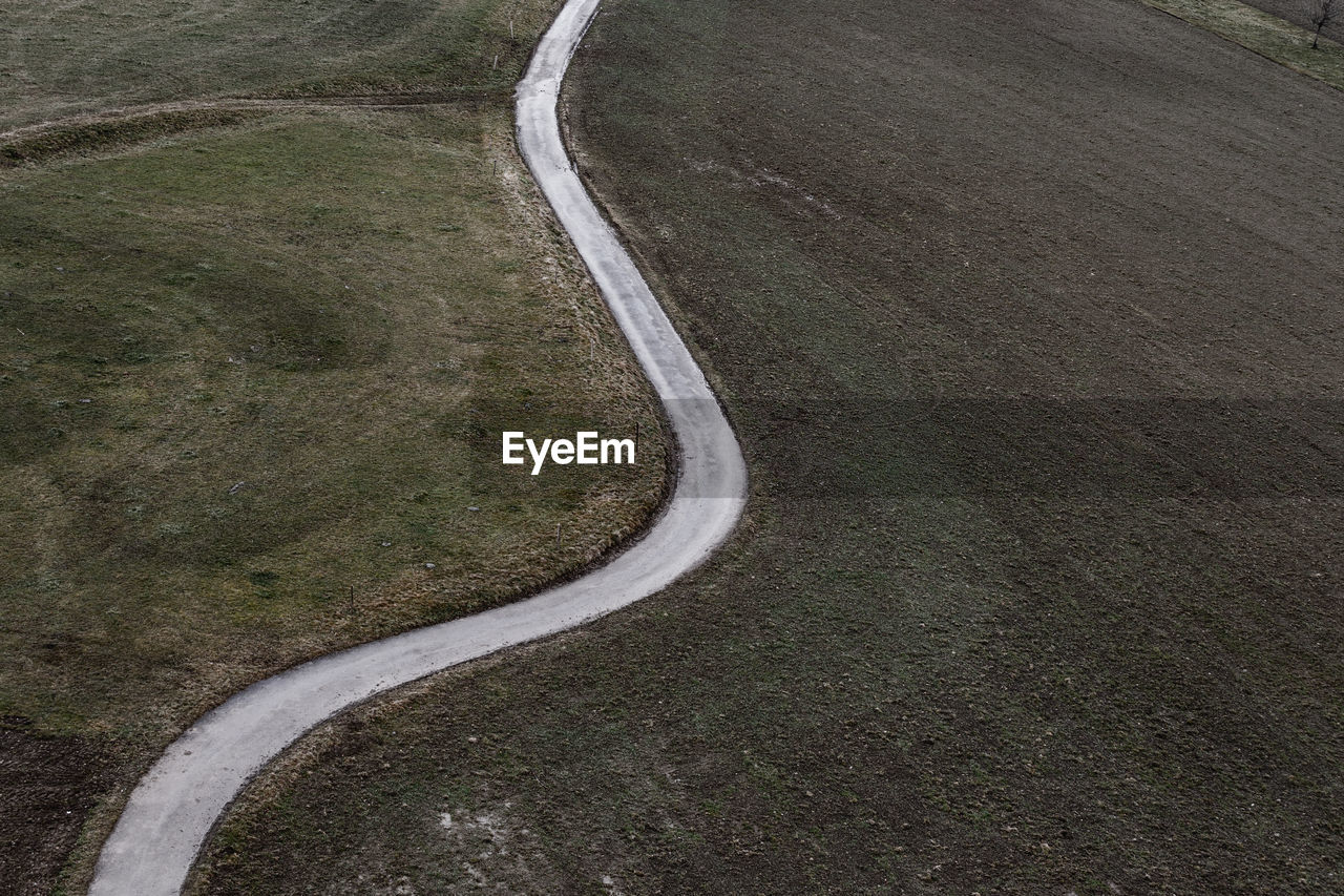 High angle view of empty road amidst landscape