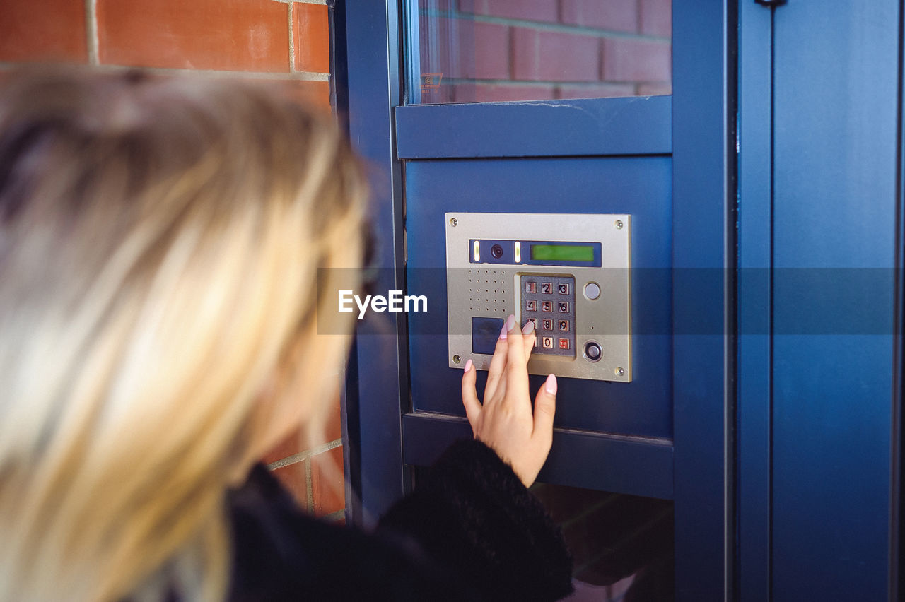 Woman using vending machine