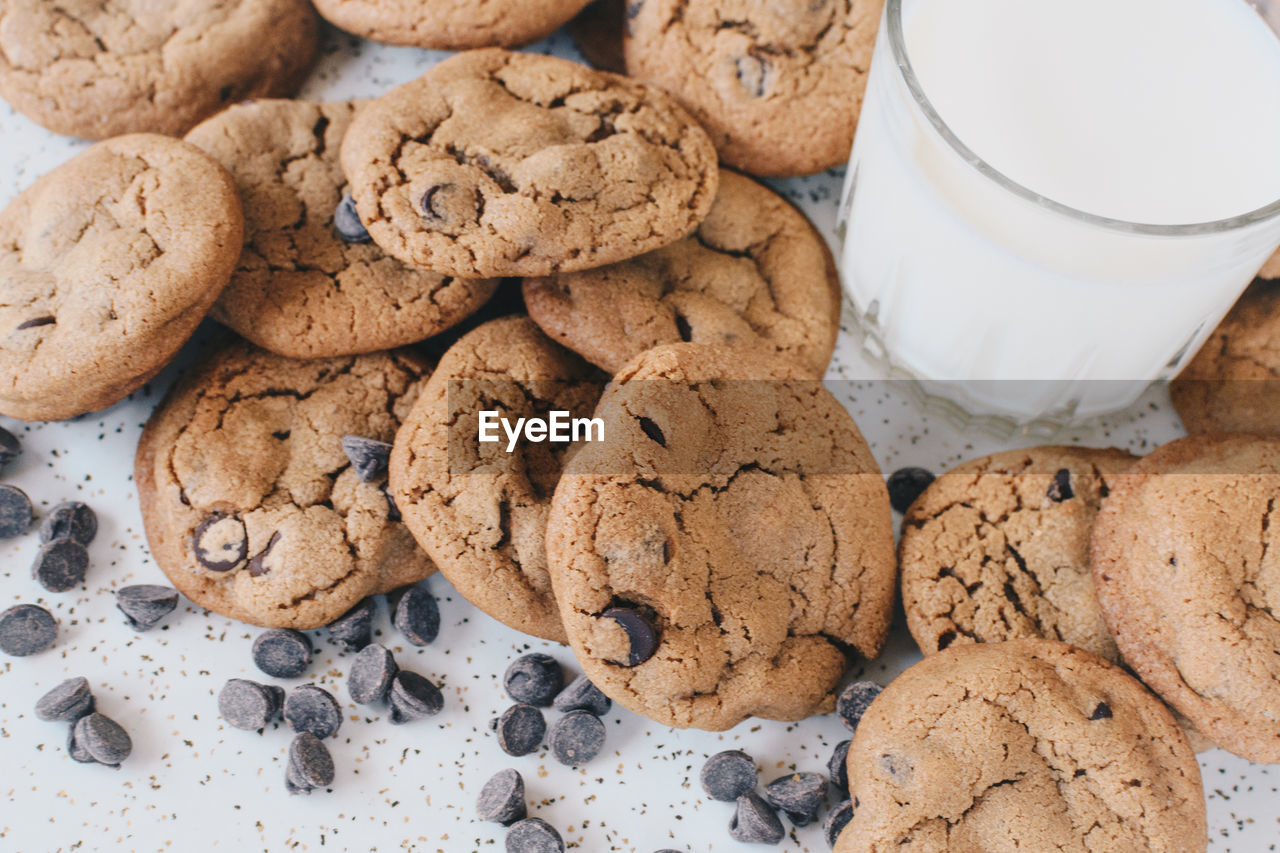 Close-up of cookies by milk glass