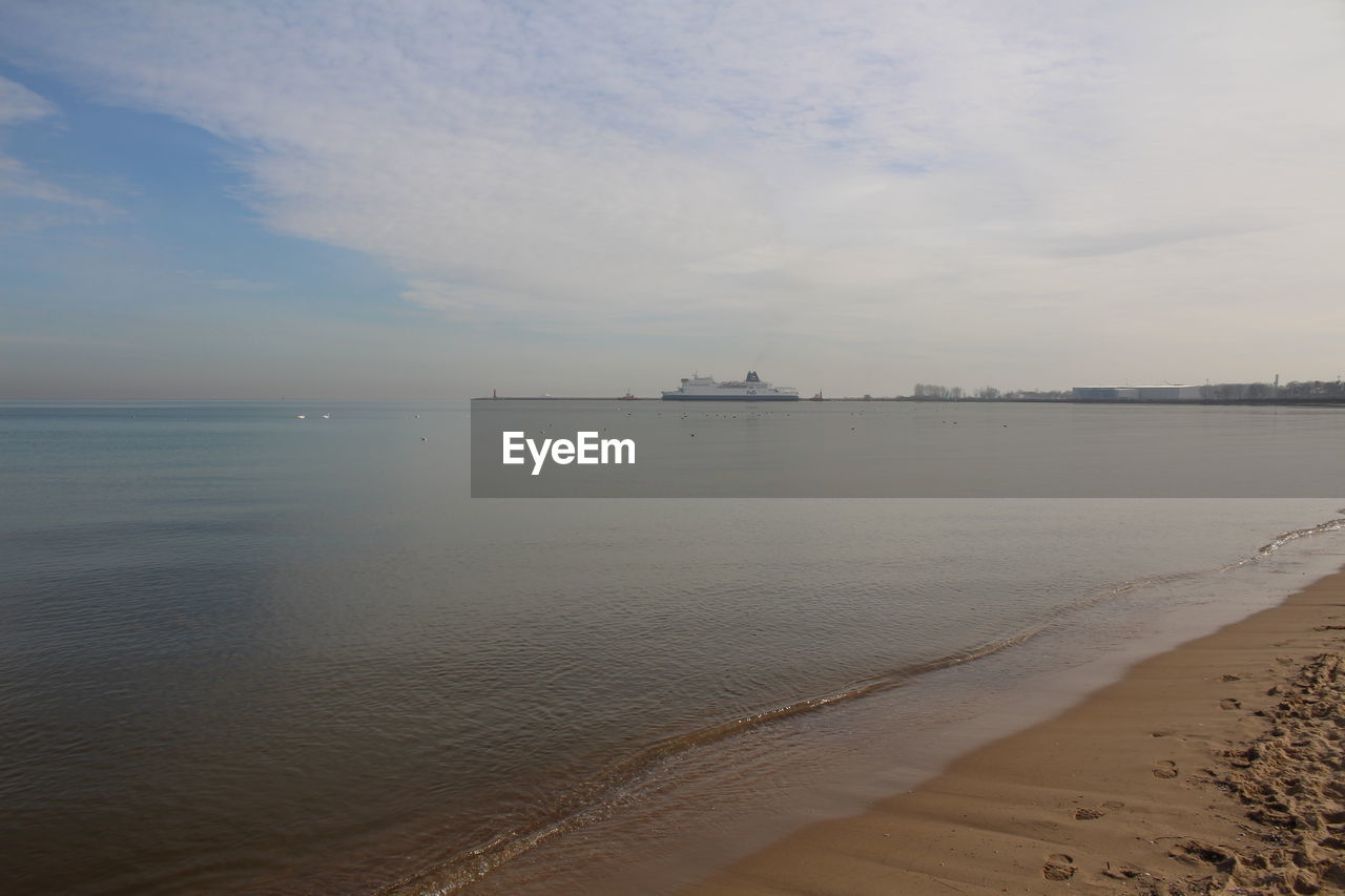 VIEW OF BEACH AGAINST SKY