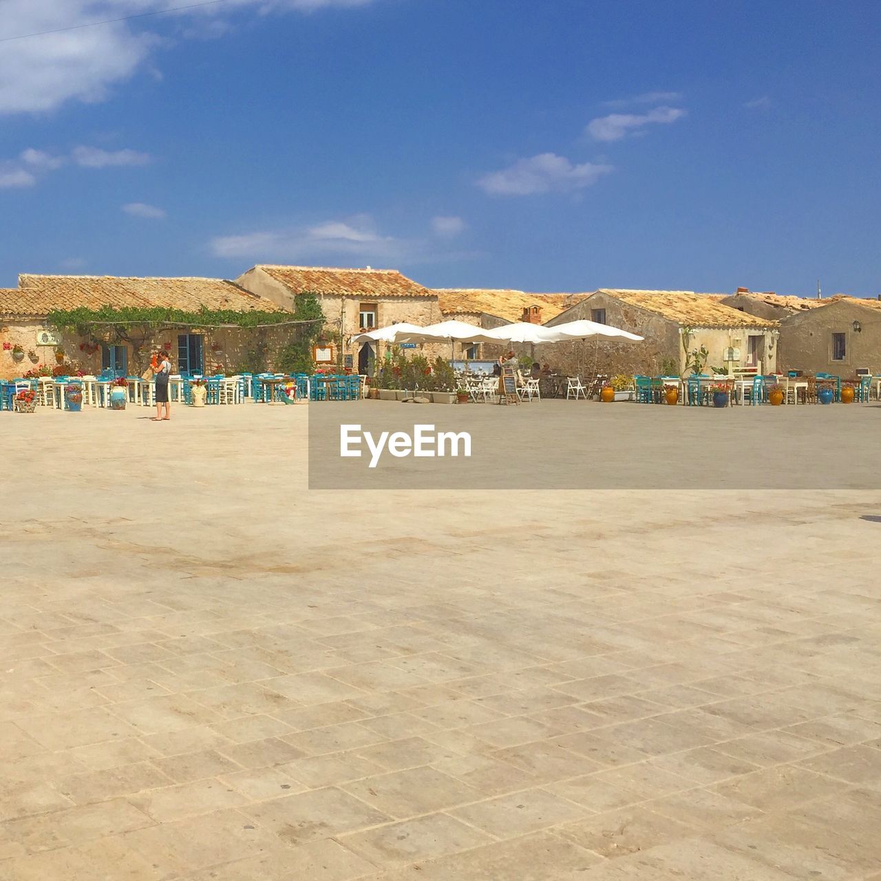 SCENIC VIEW OF BEACH AGAINST BUILDINGS