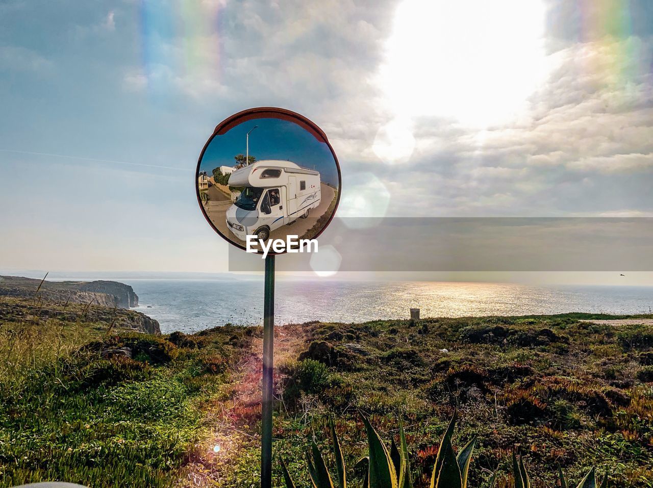 INFORMATION SIGN ON LAND AGAINST SEA