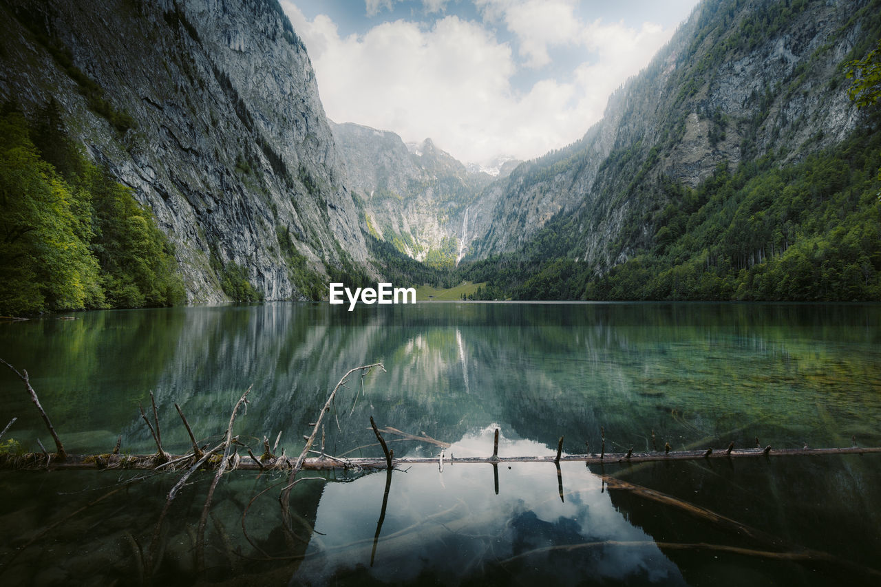 Scenic view of lake and mountains against sky