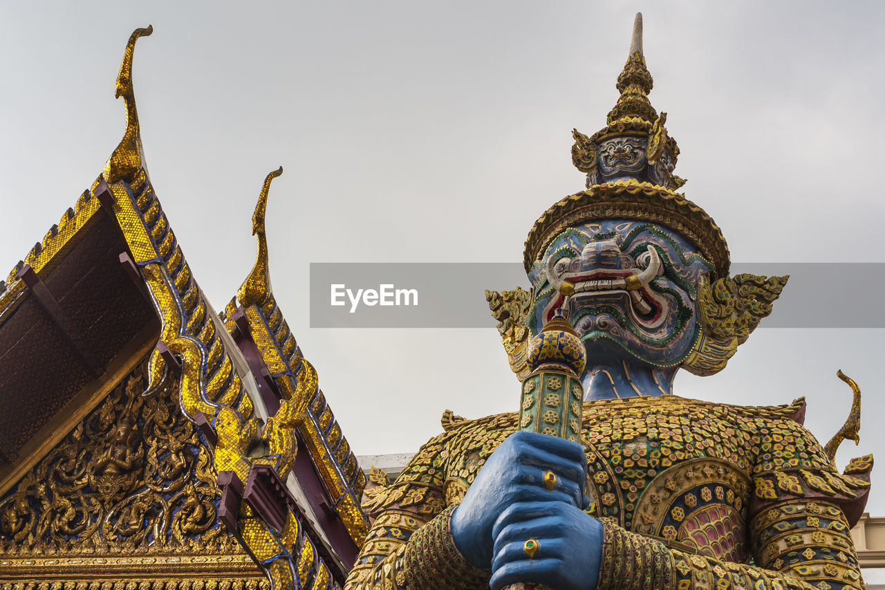 Giant statue is protect the darknest in the grand palace bangkok, thailand.