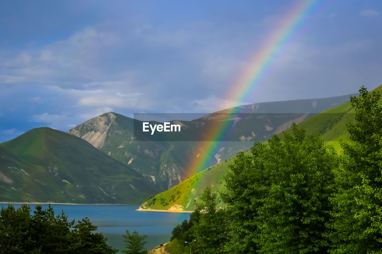 Rainbow over lake kezenoy-am in the mountains of chechnya