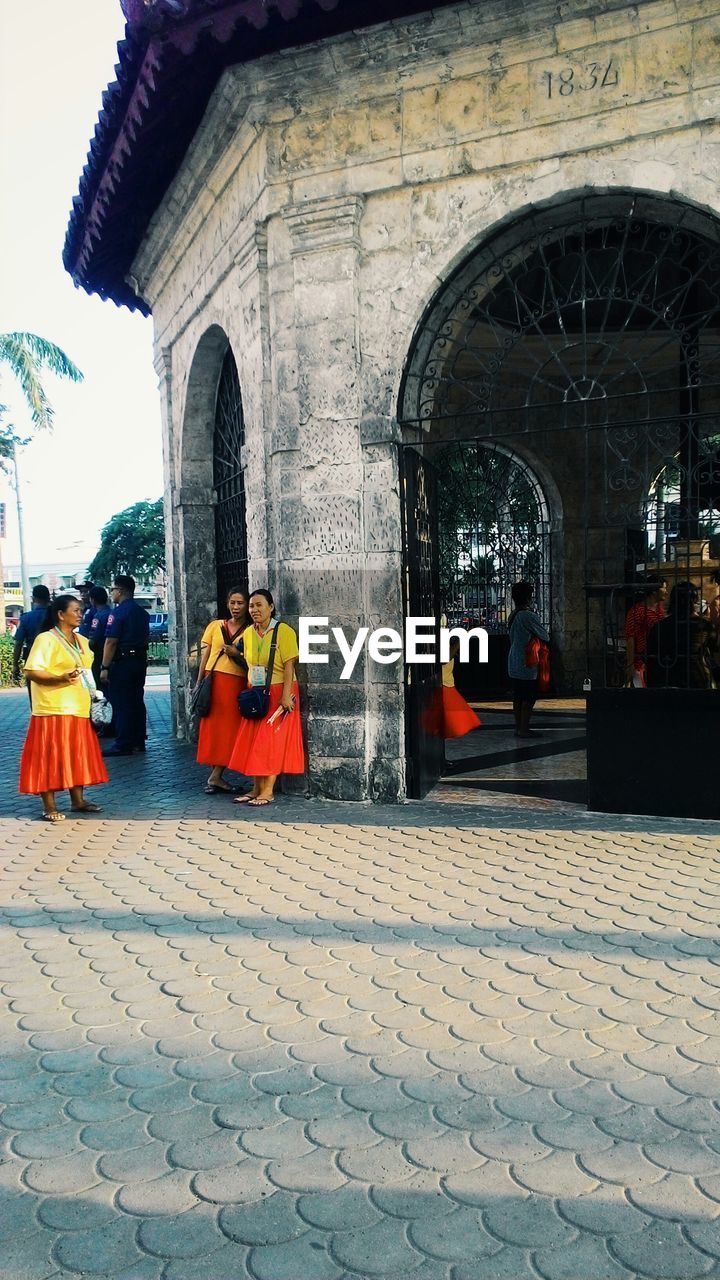 PEOPLE WALKING IN TEMPLE