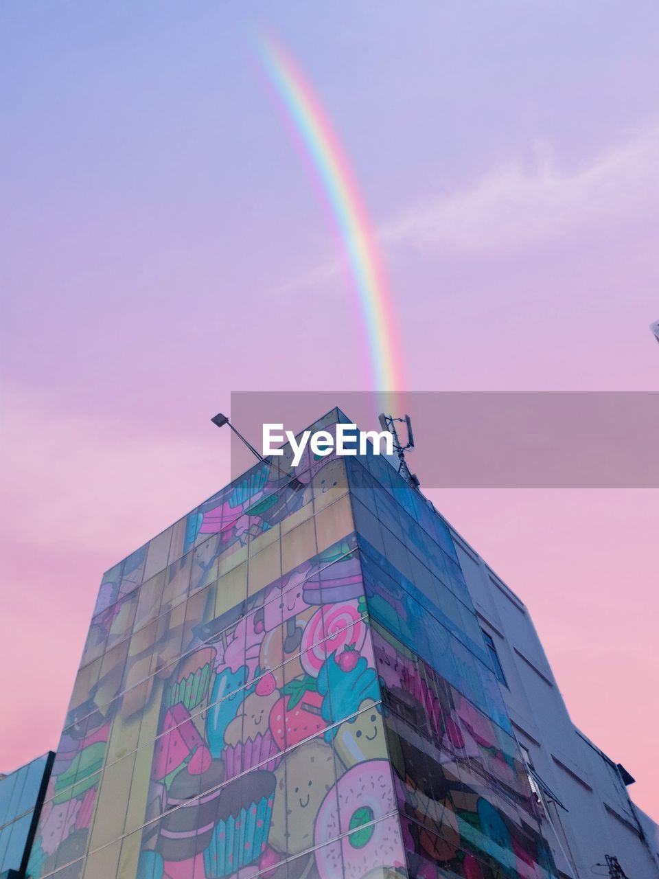 rainbow, multi colored, architecture, sky, blue, building exterior, built structure, low angle view, nature, city, building, no people, cloud, outdoors, pink, landmark, day