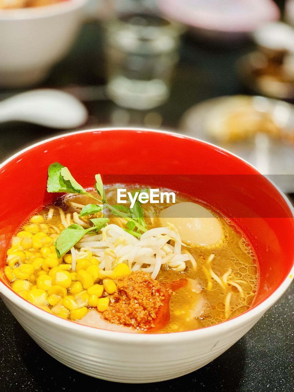 Tonkatsu broth ramen udon with corn ans spicy chilli pastr