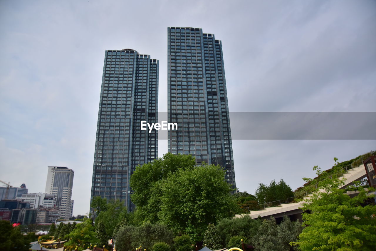 Low angle view of modern buildings against sky