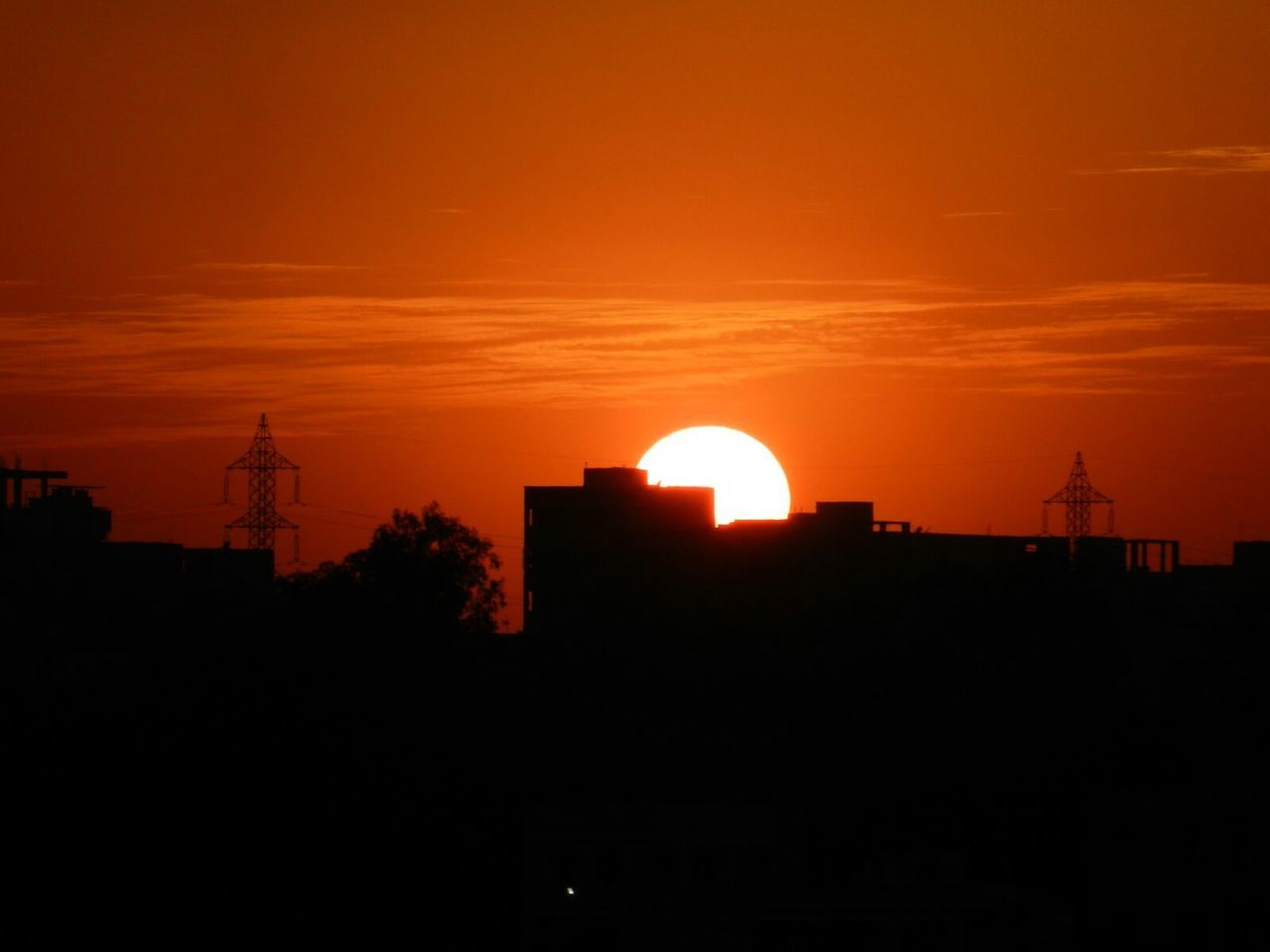 SILHOUETTE OF BUILT STRUCTURE AT SUNSET