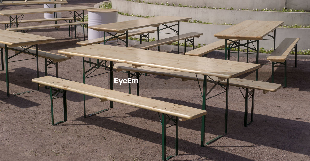 EMPTY CHAIRS AND TABLE AT RESTAURANT