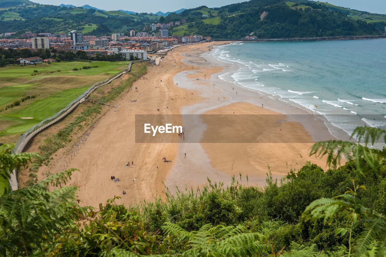 Aerial view to the zarautz beach and golf field in basque country, spain on a beautiful summer day