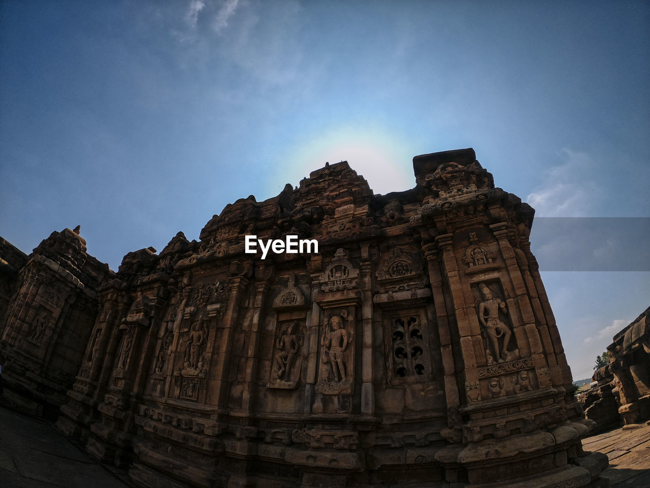 Low angle view of old temple against sky