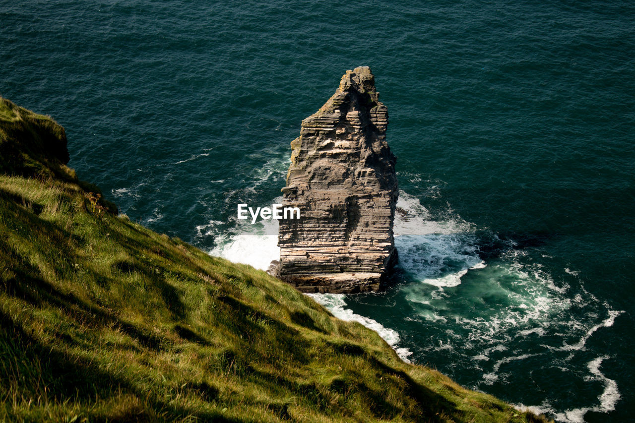 High angle view of rock formation in sea