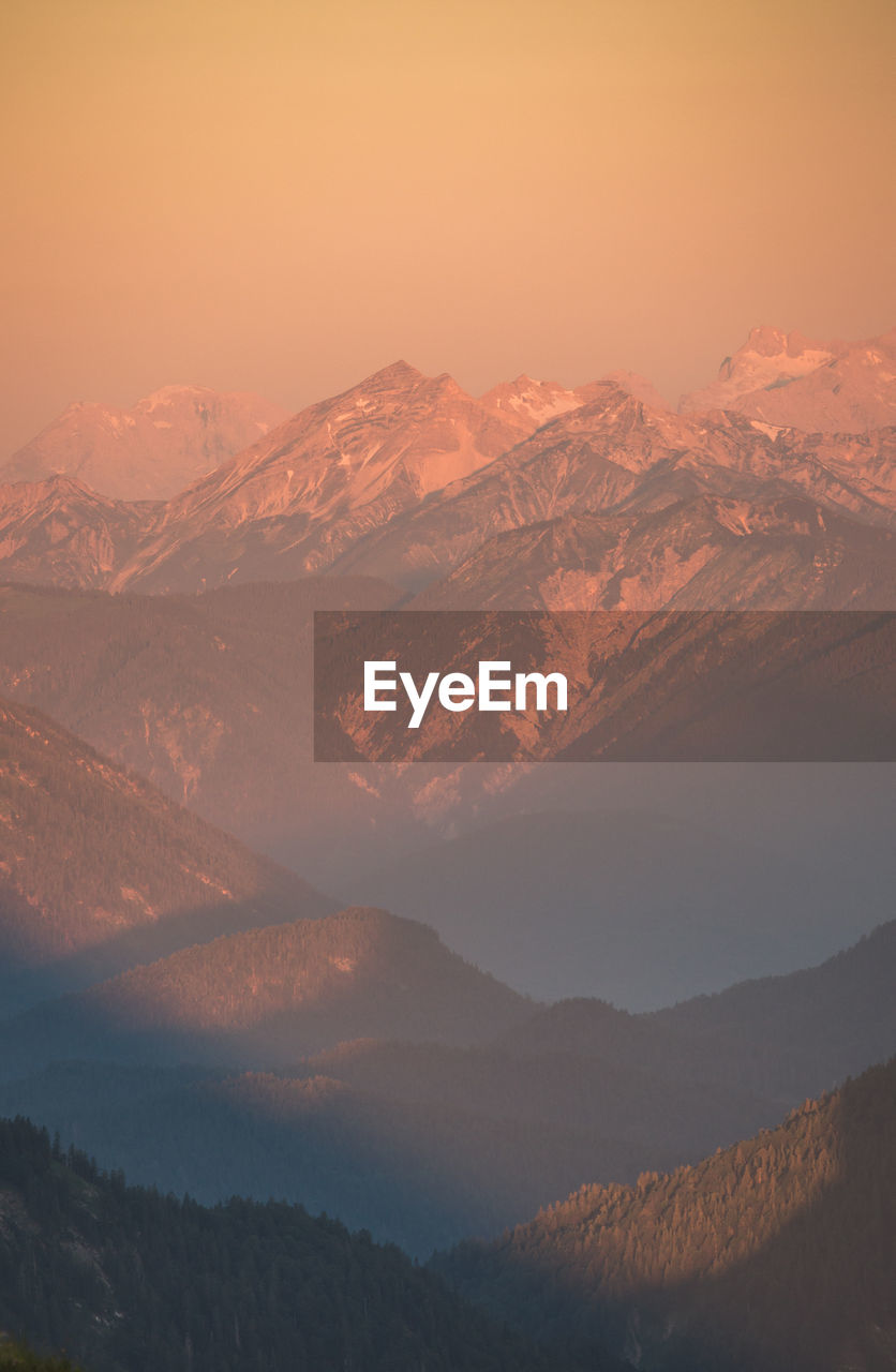 Scenic view of mountains against sky during sunset