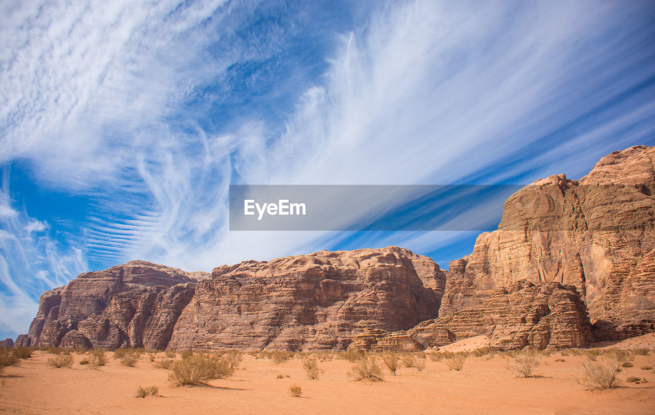 View of rocks against cloudy sky