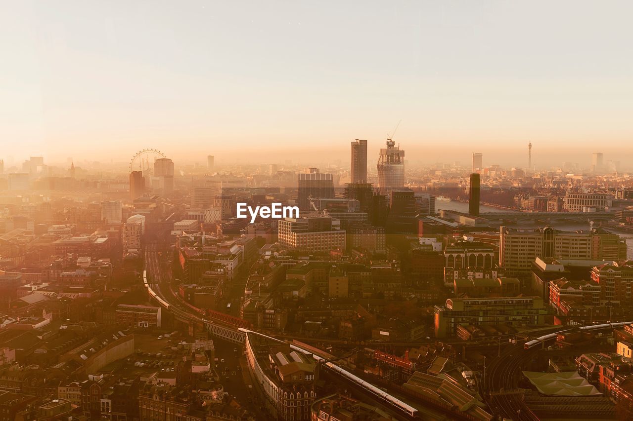 High angle view of city during sunset