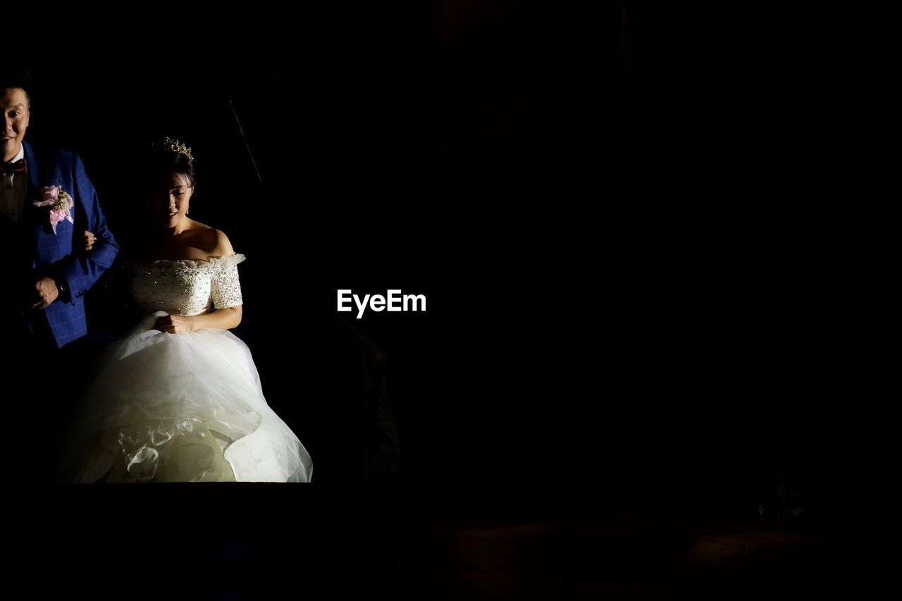 COUPLE HOLDING ILLUMINATED LIGHTING EQUIPMENT