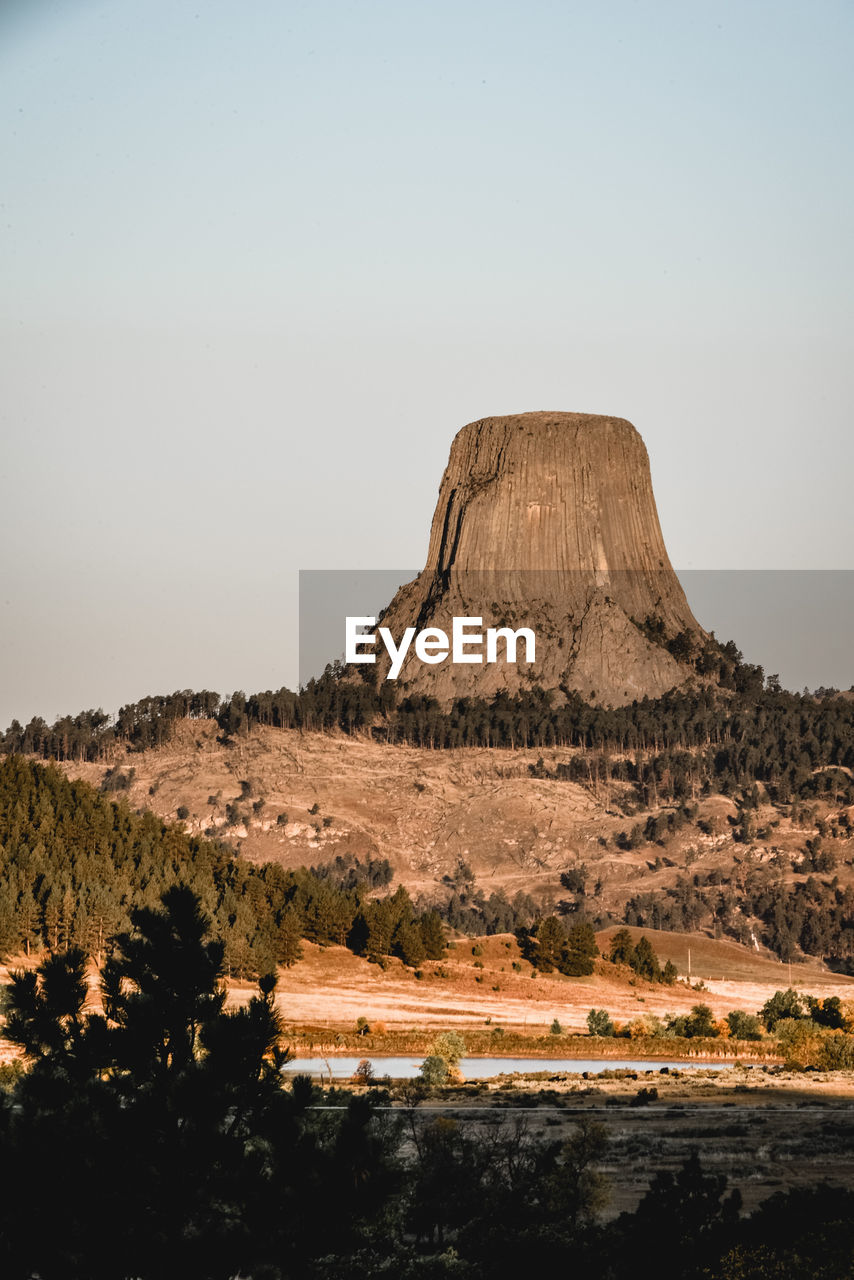 Scenic view of rock formation against sky during sunset