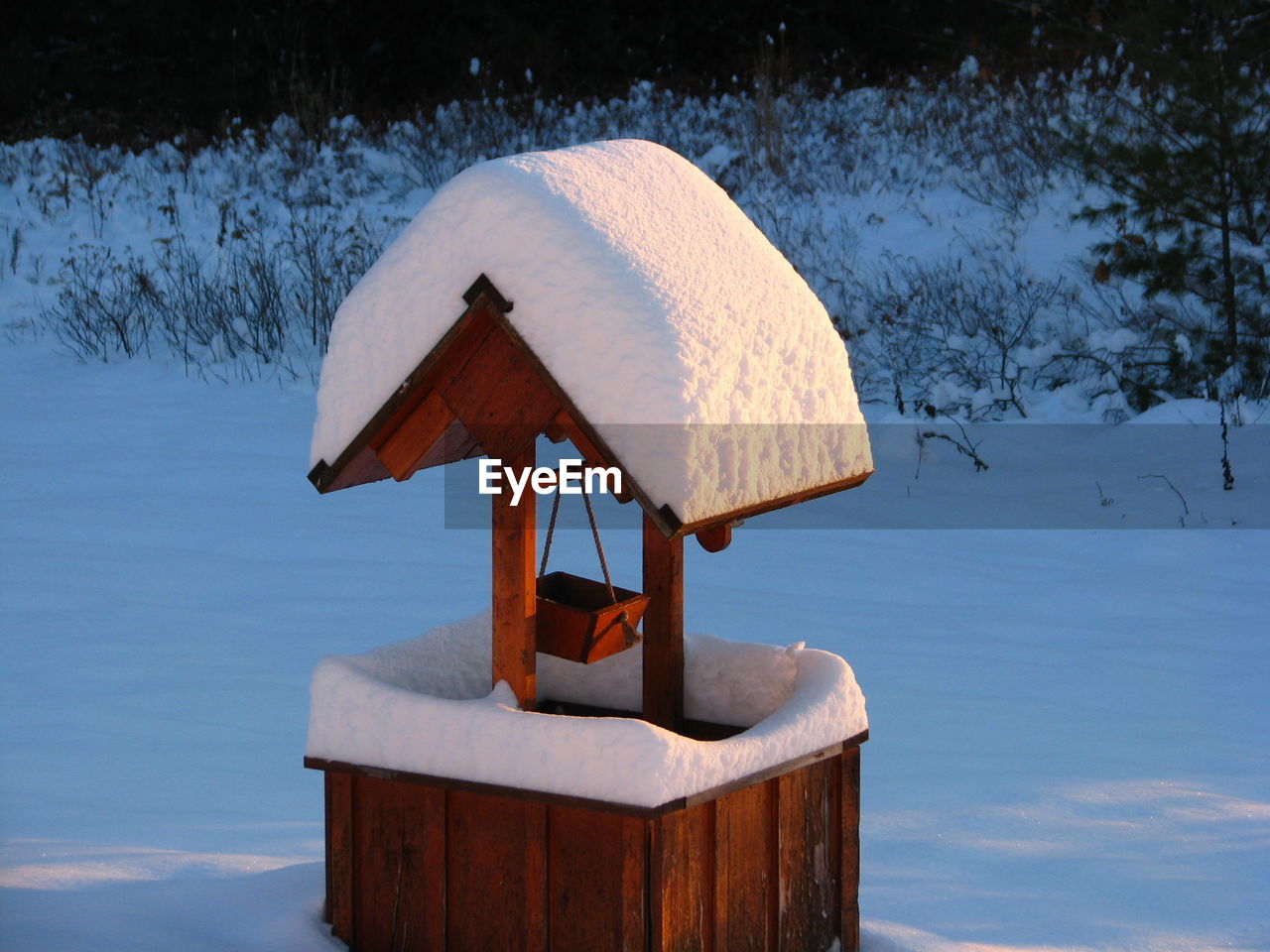 Snow covered wishing well