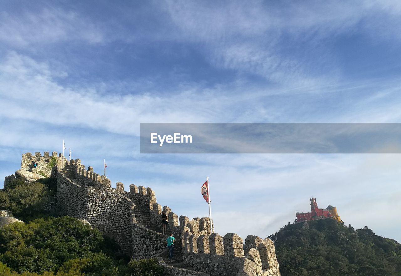 CASTLE AGAINST CLOUDY SKY