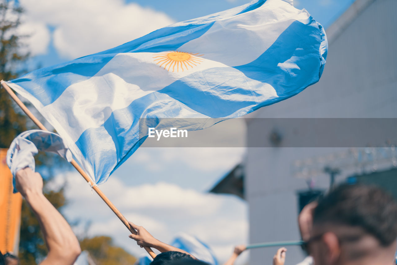 Argentinian flag and people celebrating