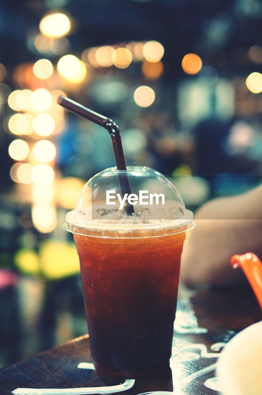 Close-up of drink in disposable cup on table