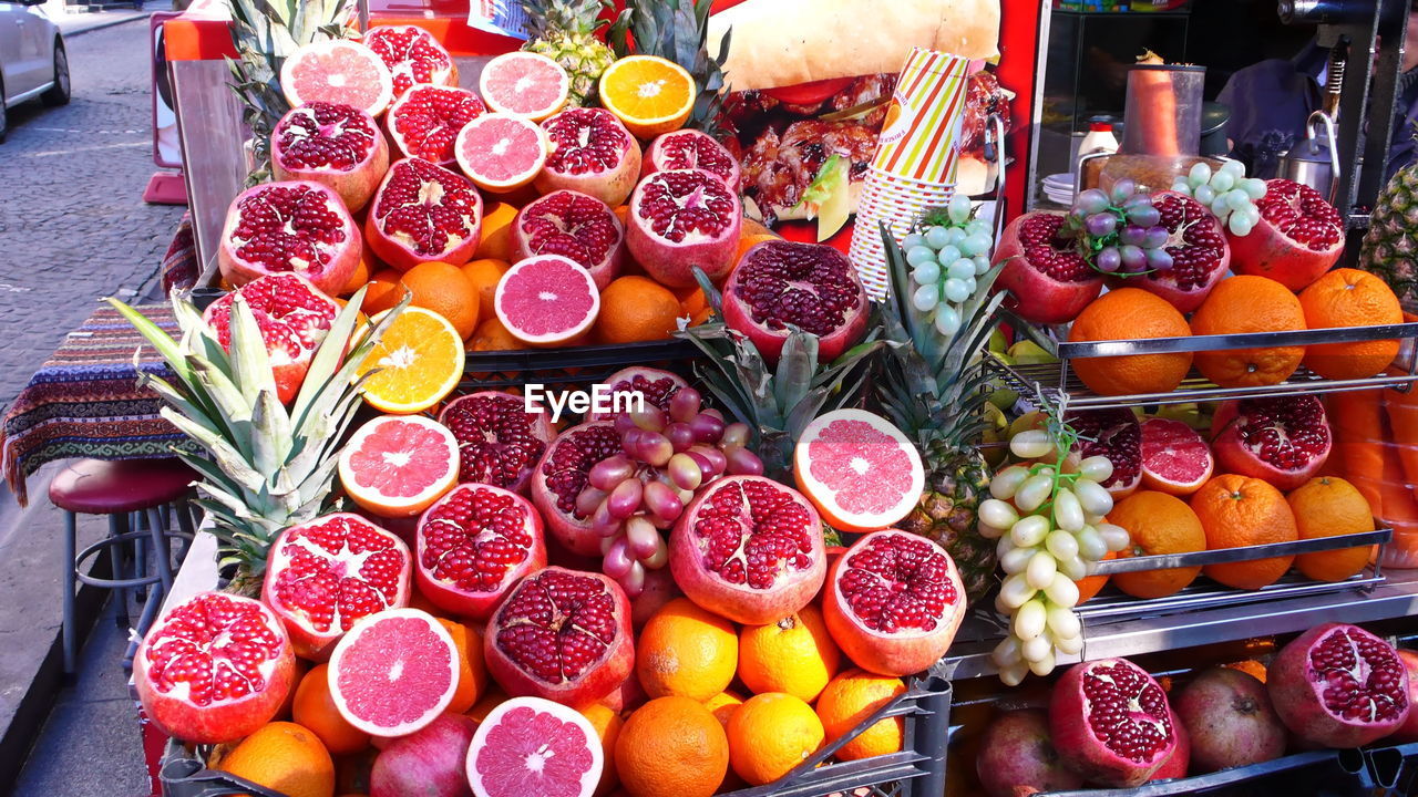 HIGH ANGLE VIEW OF VARIOUS FRUITS FOR SALE IN MARKET
