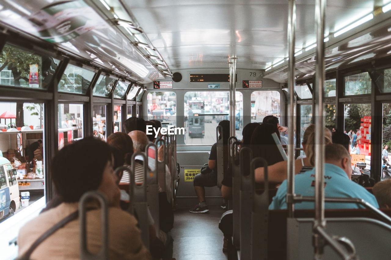 Rear view of people sitting in cable car