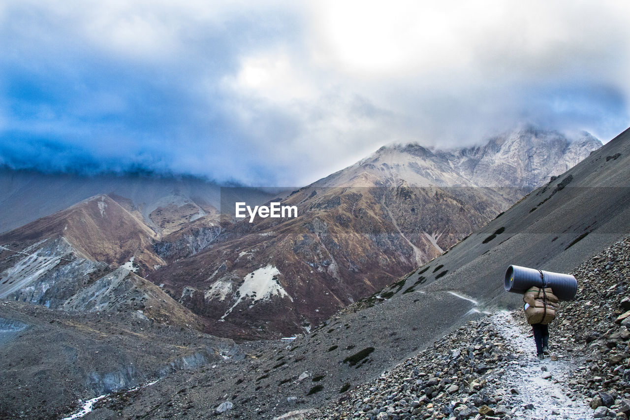 Sherpa carrying mattress in himalaya