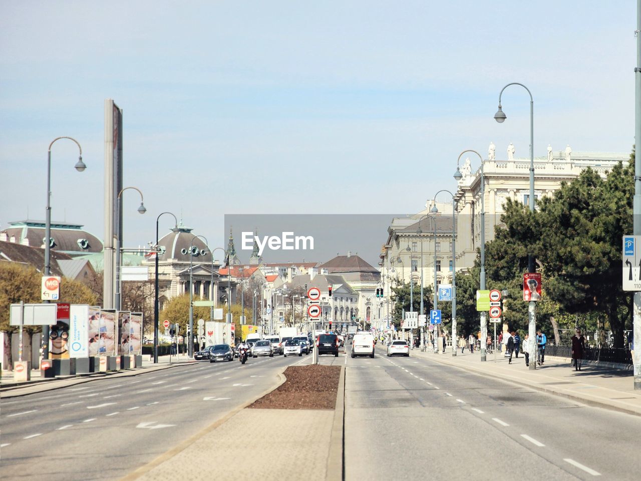 Vehicles on road along buildings