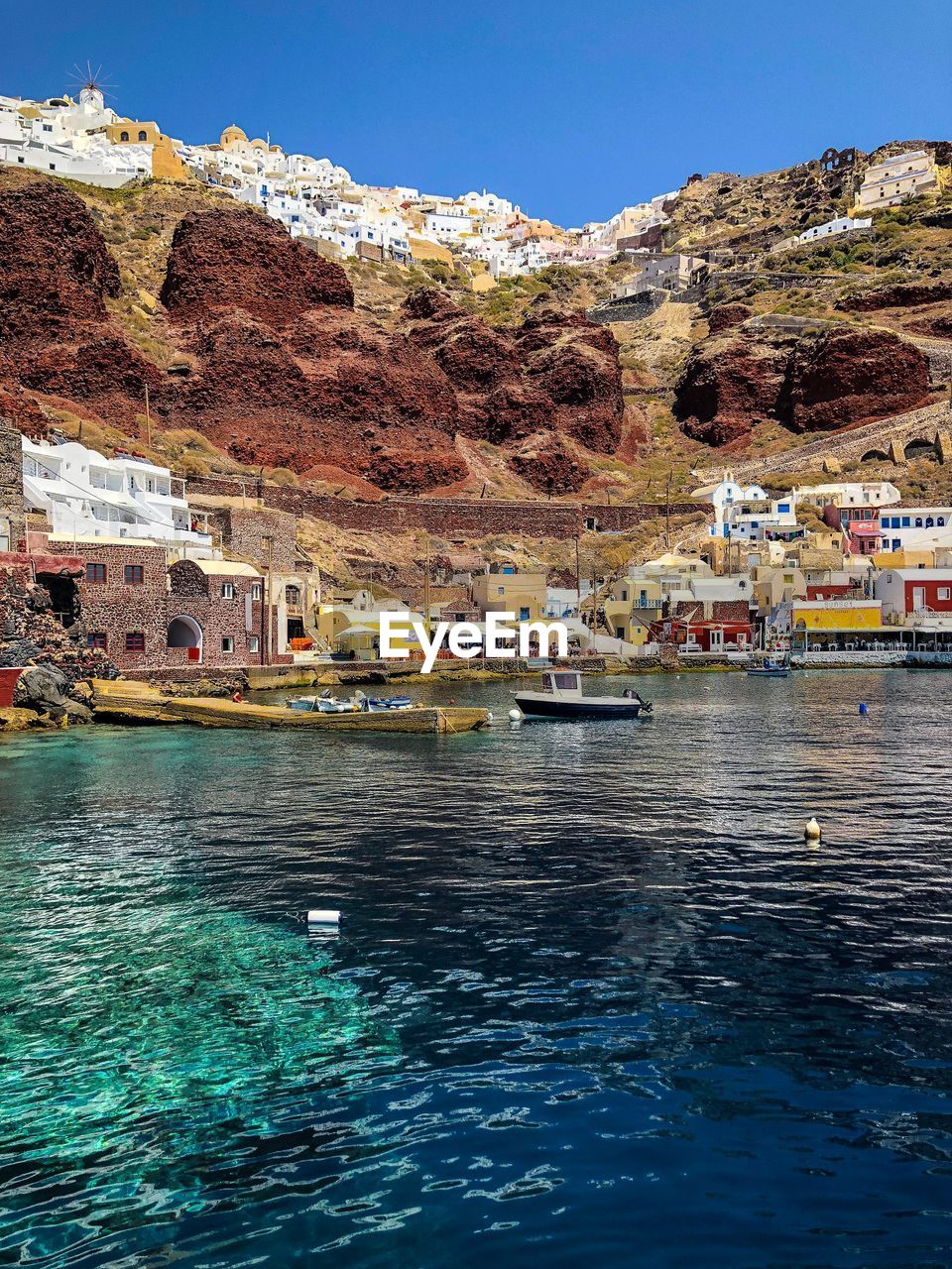 SCENIC VIEW OF SEA AGAINST BUILDINGS