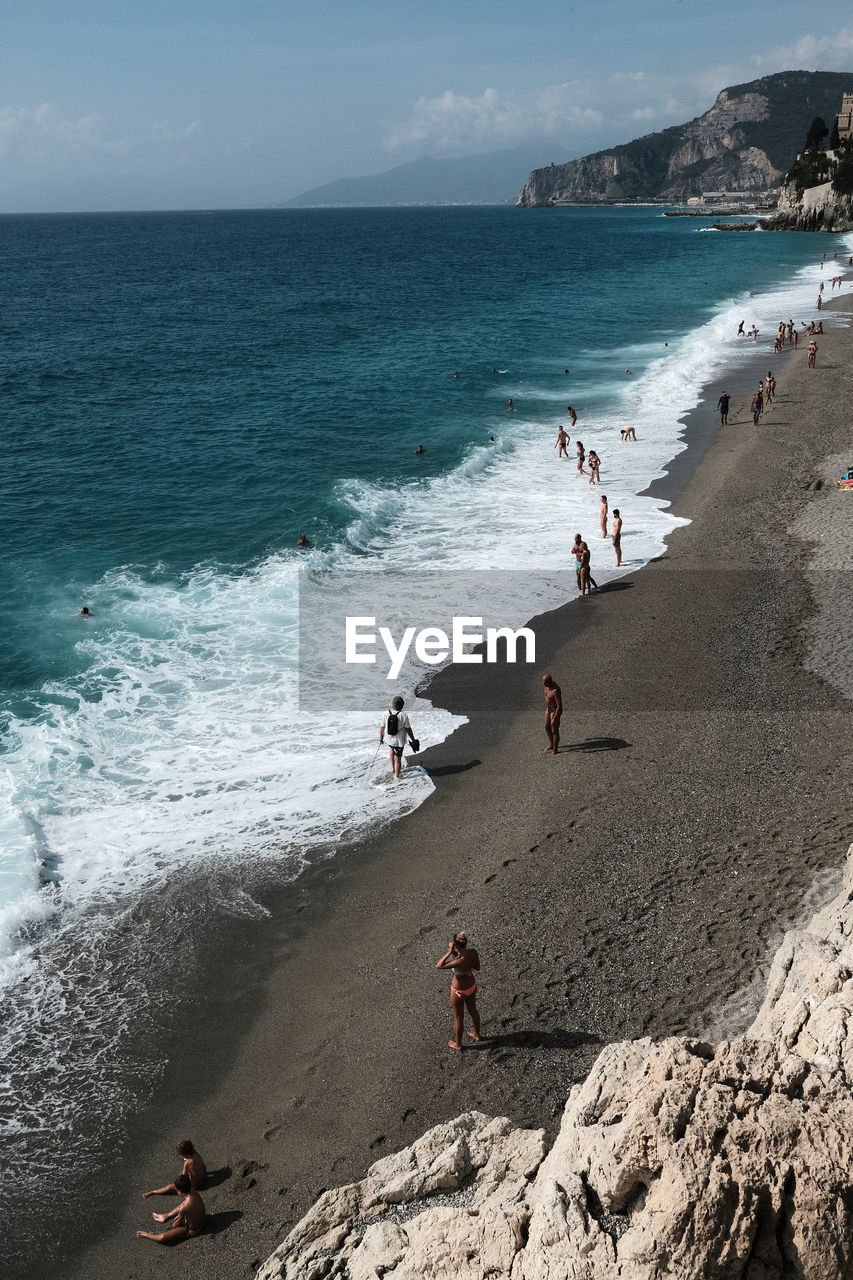 PEOPLE ENJOYING ON BEACH