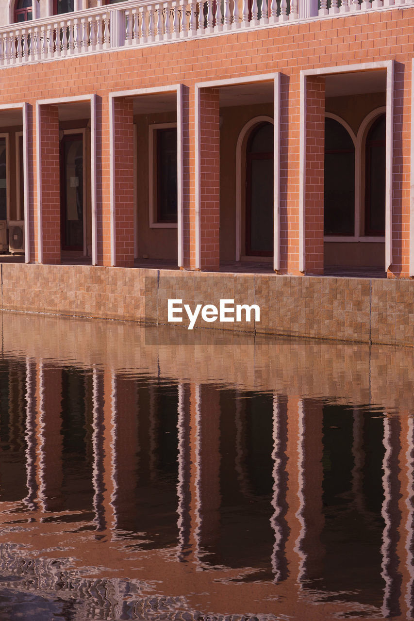 REFLECTION OF BUILDING ON WATER