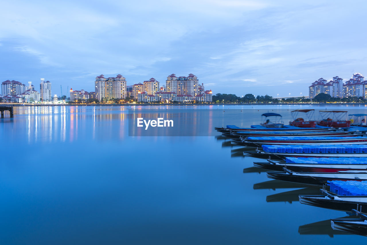 Panoramic view of illuminated city buildings against sky