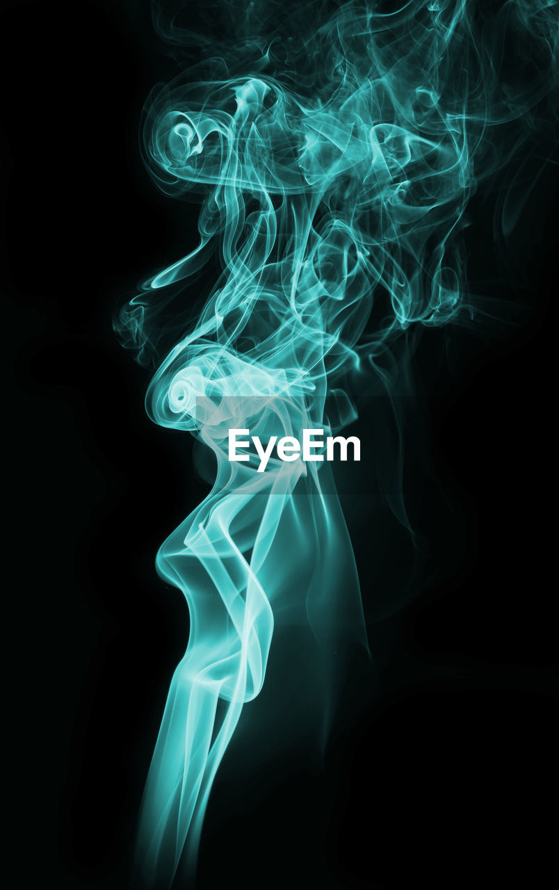 Close-up of smoke against black background