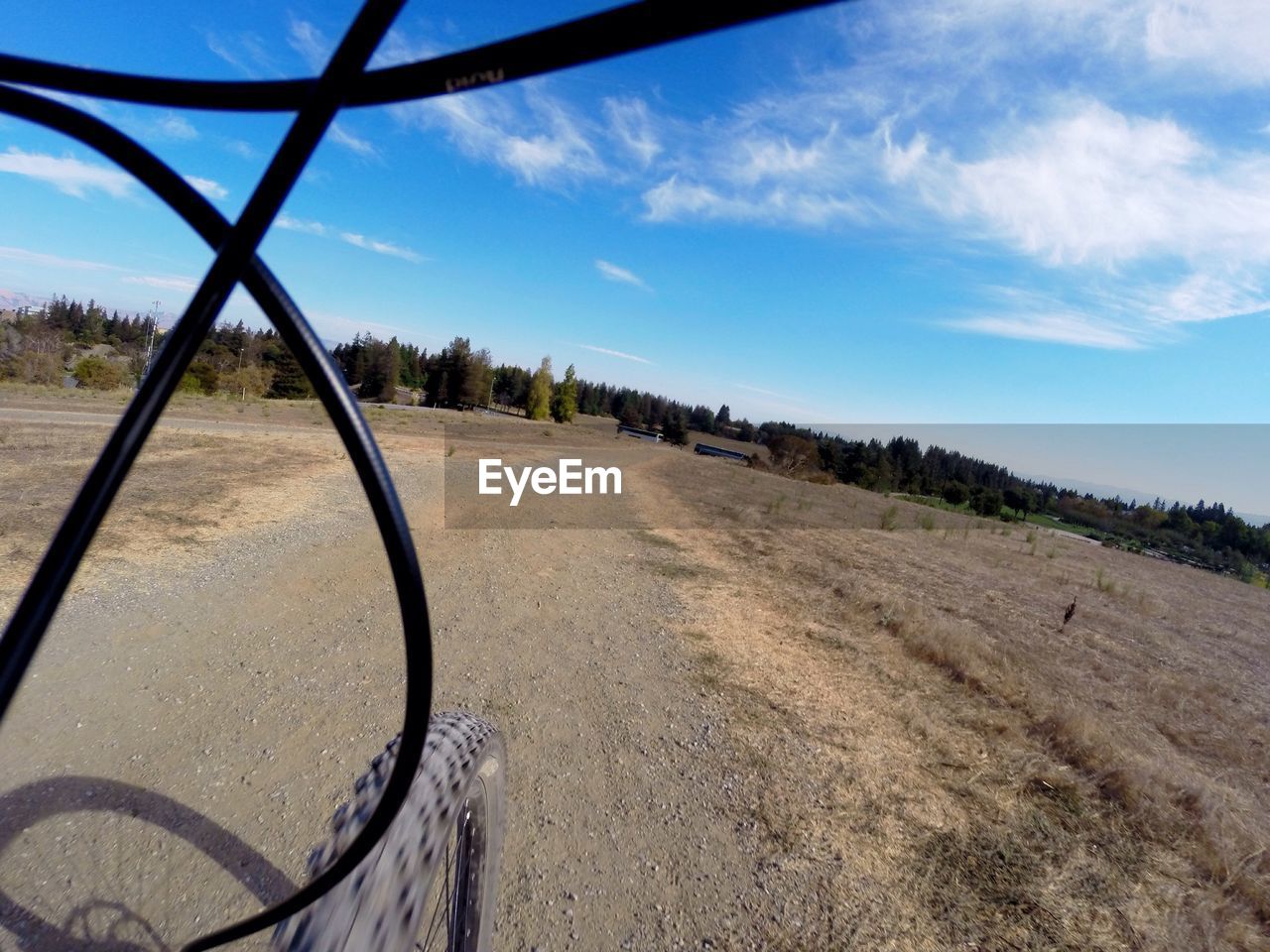 CROPPED IMAGE OF COUNTRY ROAD AGAINST BLUE SKY