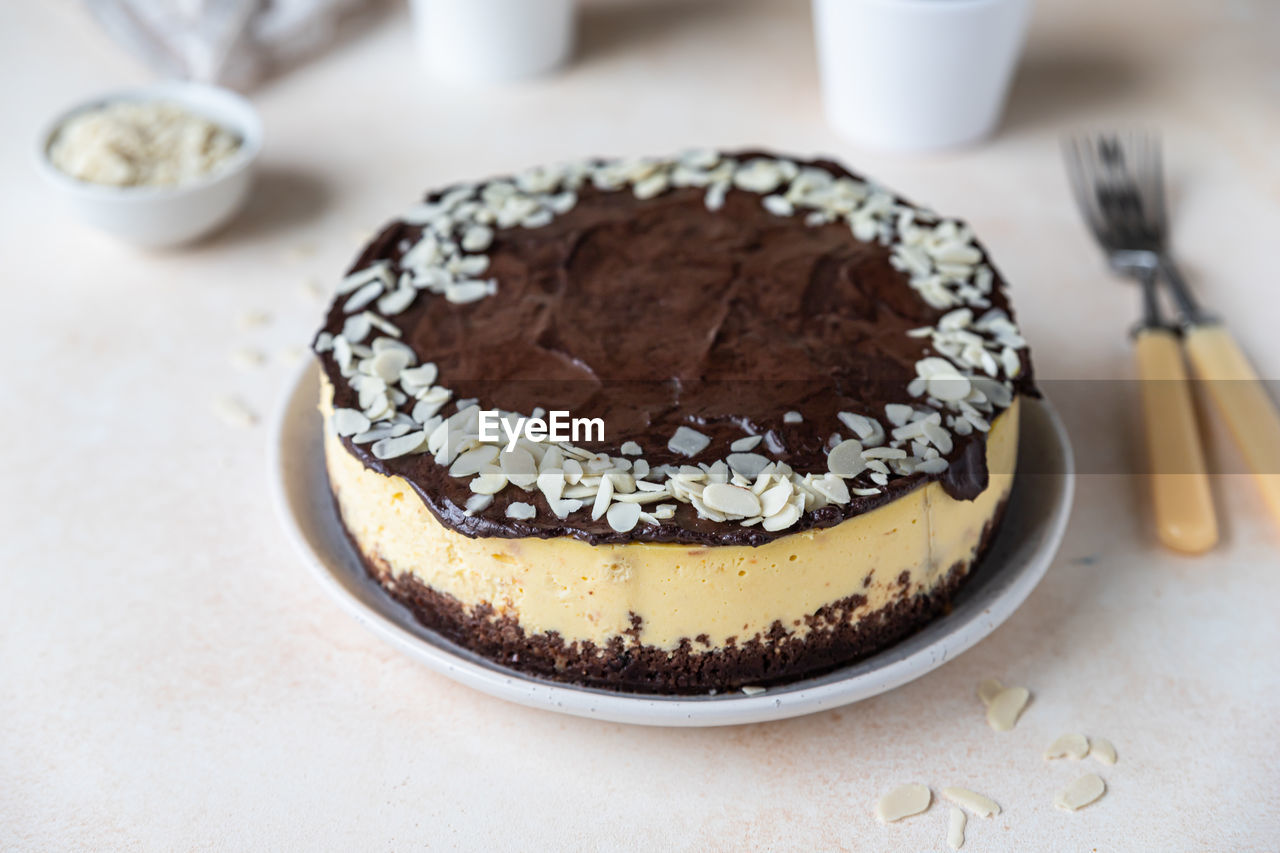 Delicious creamy cheesecake with chocolate glaze and almond. no bake mousse dessert.