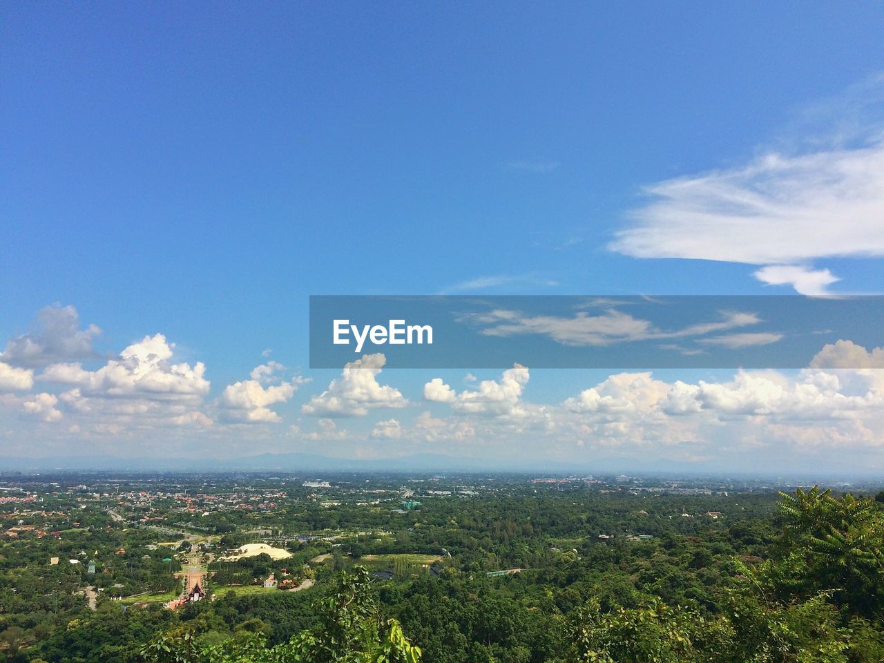 Scenic view of landscape against blue sky