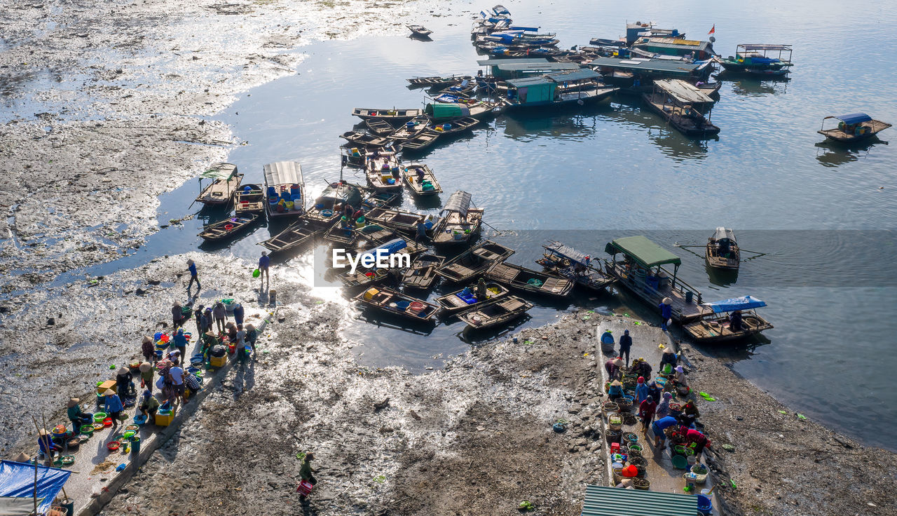 HIGH ANGLE VIEW OF PEOPLE ENJOYING AT SEA