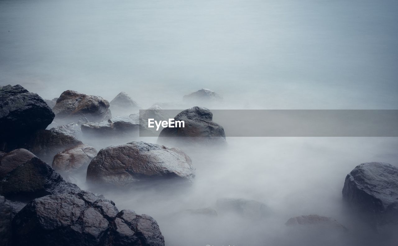 Scenic view of rocks against sky