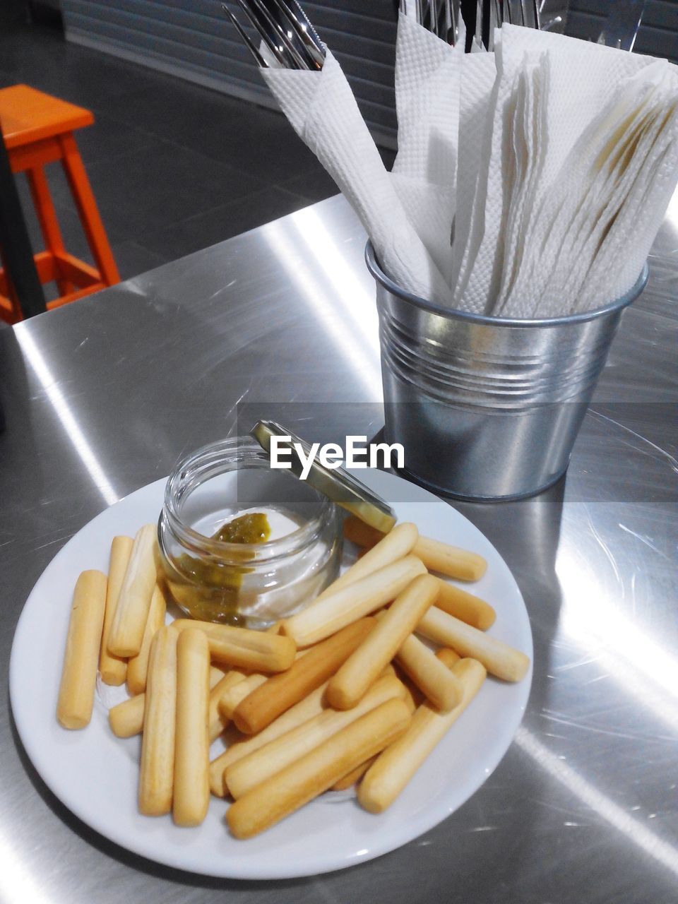 High angle view of breadsticks in plate on table