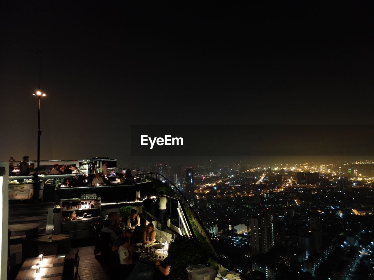 High angle view of people at banyan tree bangkok during night