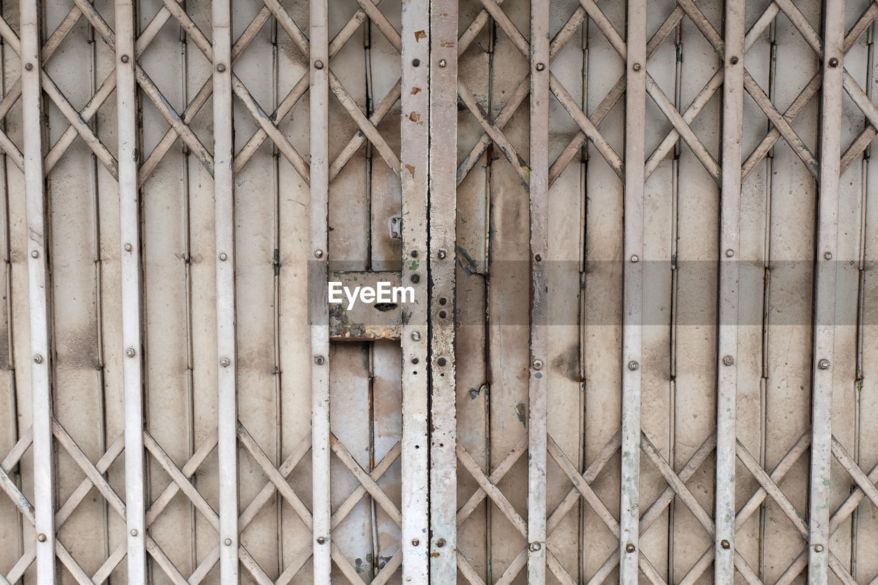 Full frame shot of closed metal gate