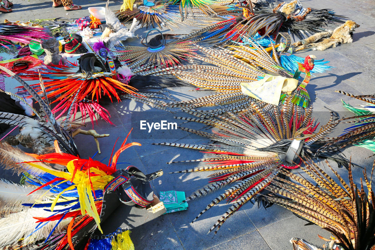 HIGH ANGLE VIEW OF MULTI COLORED UMBRELLAS AT MARKET