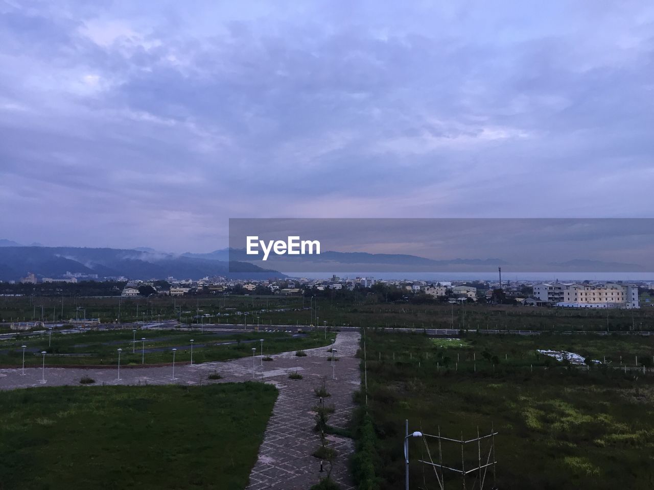 HIGH ANGLE VIEW OF CITY AT WATERFRONT