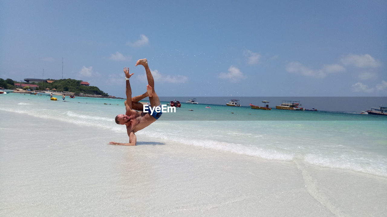 PERSON ON BEACH AGAINST SKY